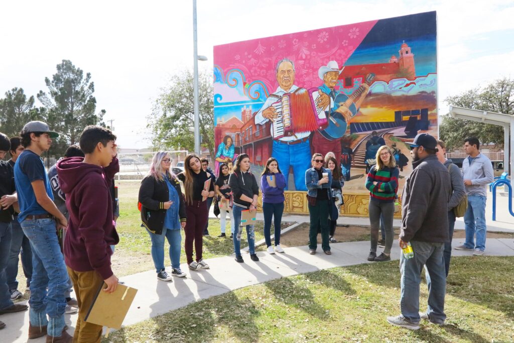 Marfa students visiting with muralist Cimi Alvarado in El Paso.